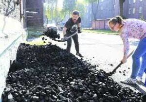 A coal miner with his wife throw coal into the basement of a house in Mikolow in Poland’s southern mining region of Silesia. Despite COP24 climate talks, Polish miners see future in coal. Reuters